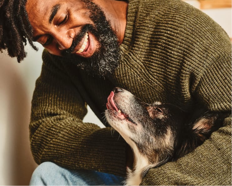 Man looking at dog