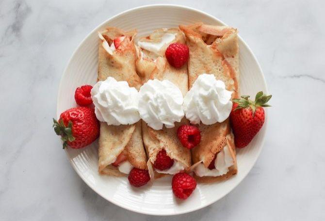 Plate of crepes and whipped cream